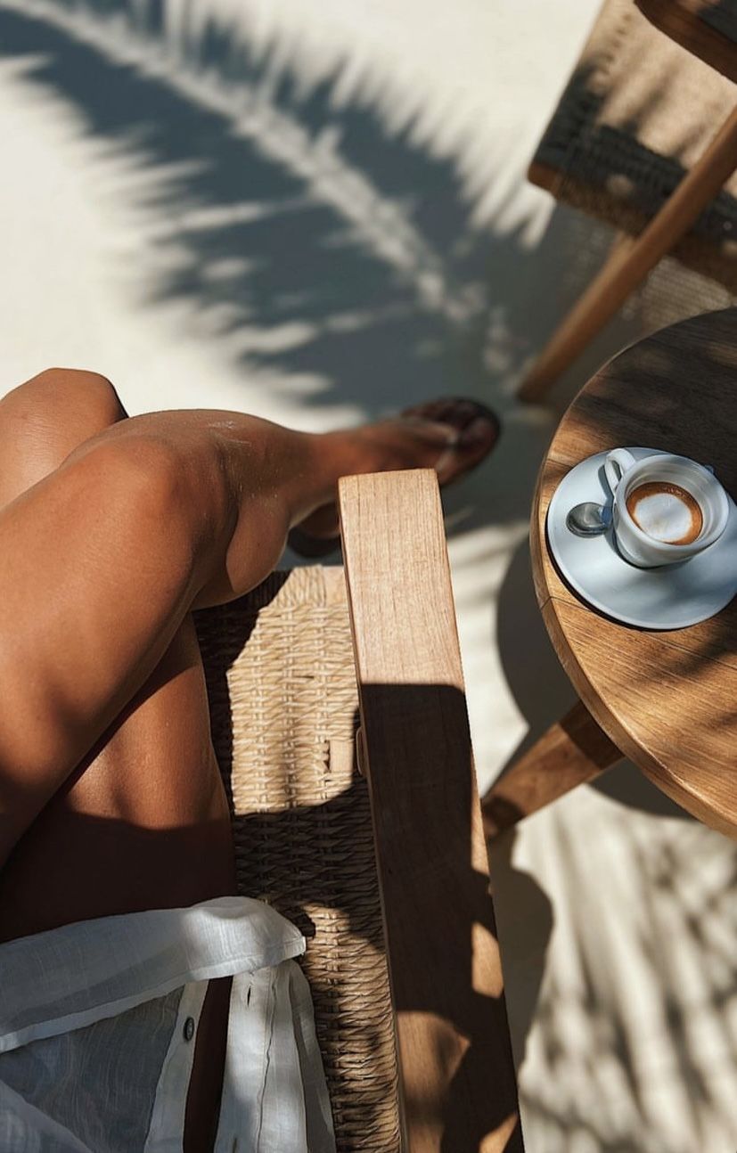Coffee beside a shaded poolside chair